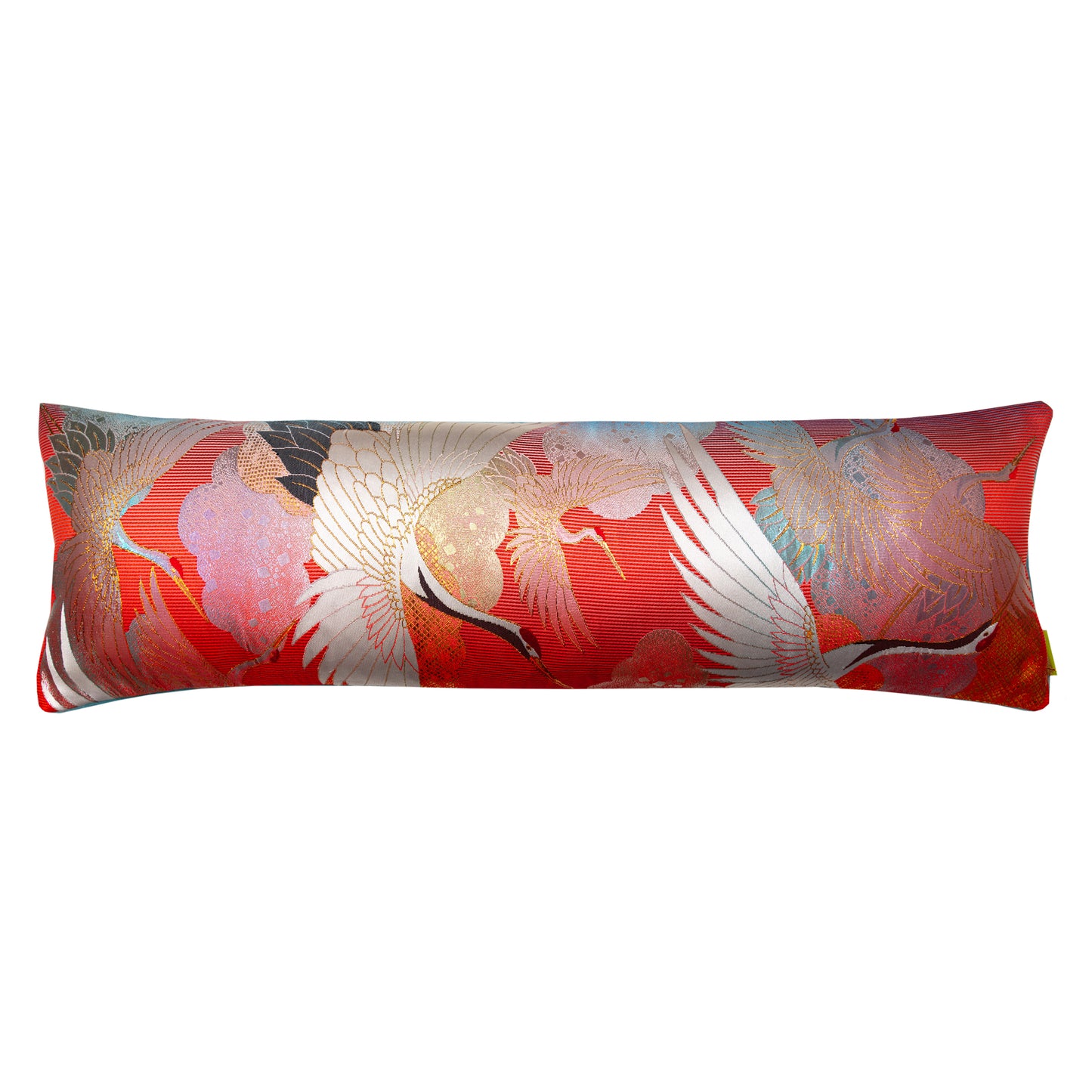 Kimono silk bolster pillow in red silk with blue velvet reverse on a white background.