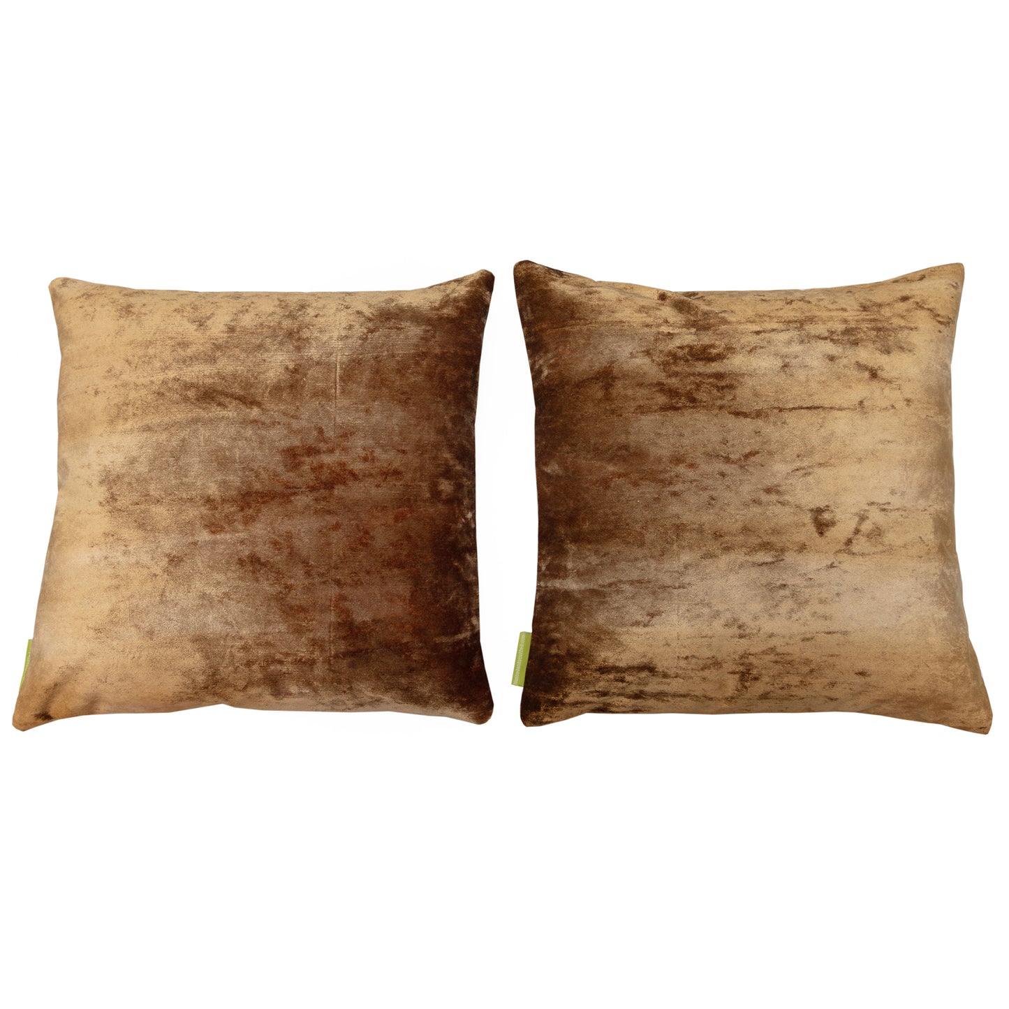 Designer gold velvet pillow backs on white background.