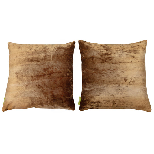 Designer gold velvet pillow backs on white background.