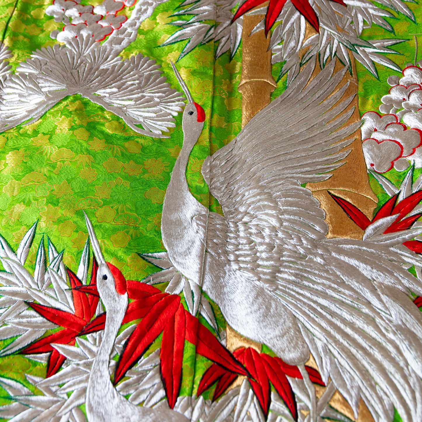 Silver crane kimono throw on green silk base