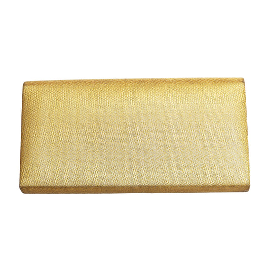 Gold clutch bag on a light background