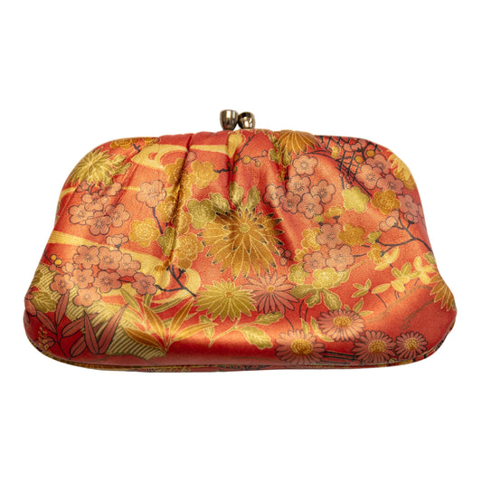 Floral patterned clutch bag on a white background