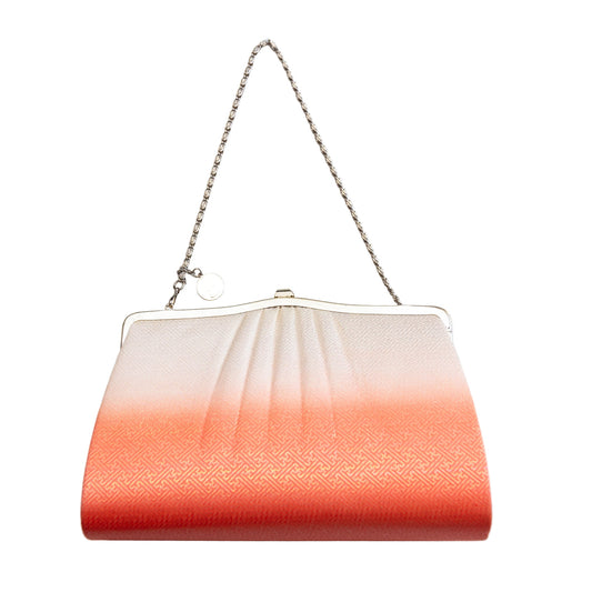 Clutch bag with gradient design and chain strap on a white background