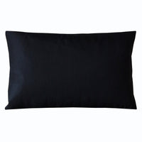 Black silk back of the rectangular pillow.