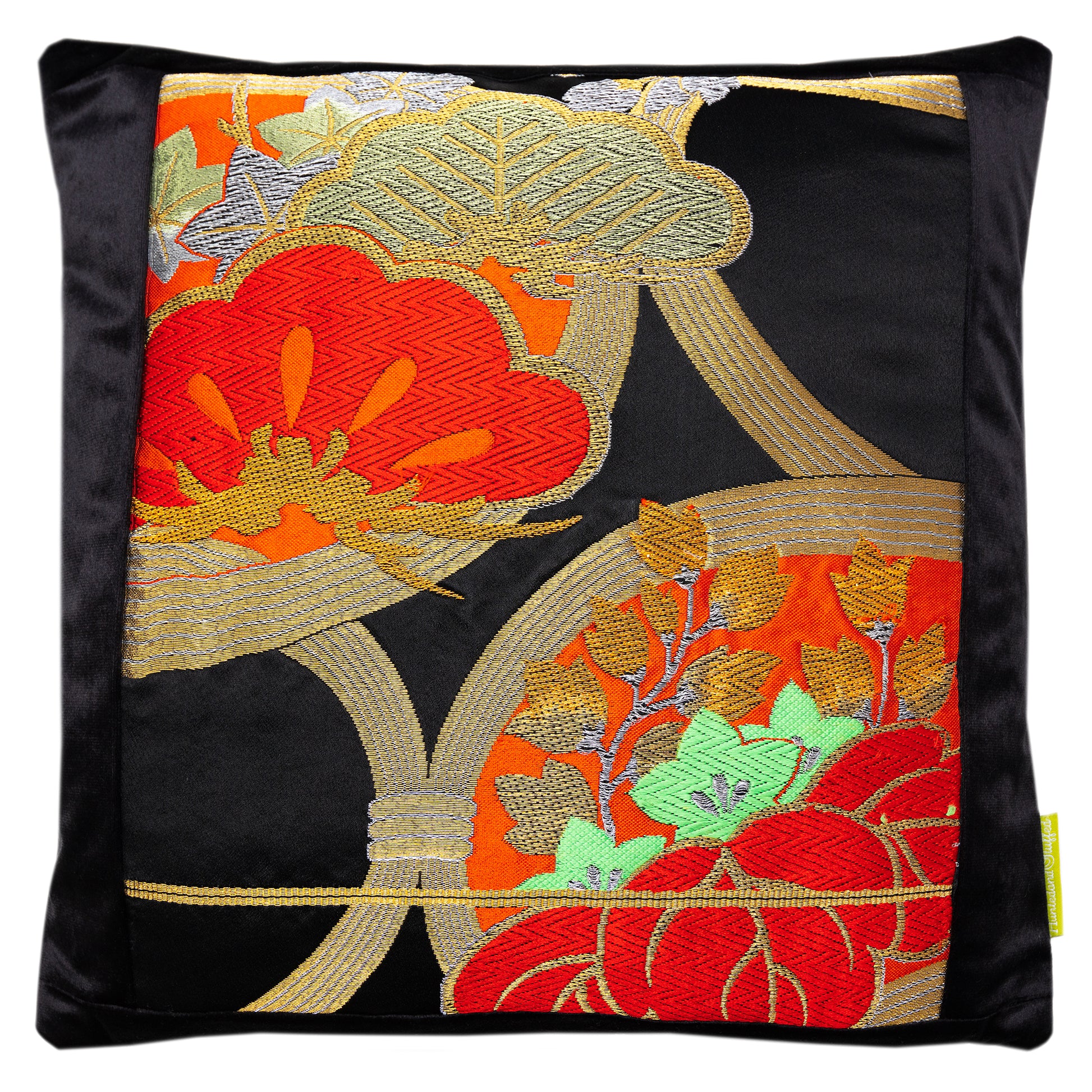 Black silk and black velvet japanese pillow with red flowers by Hunted and Stuffed, London. Shows the gold line of the end of the obi.