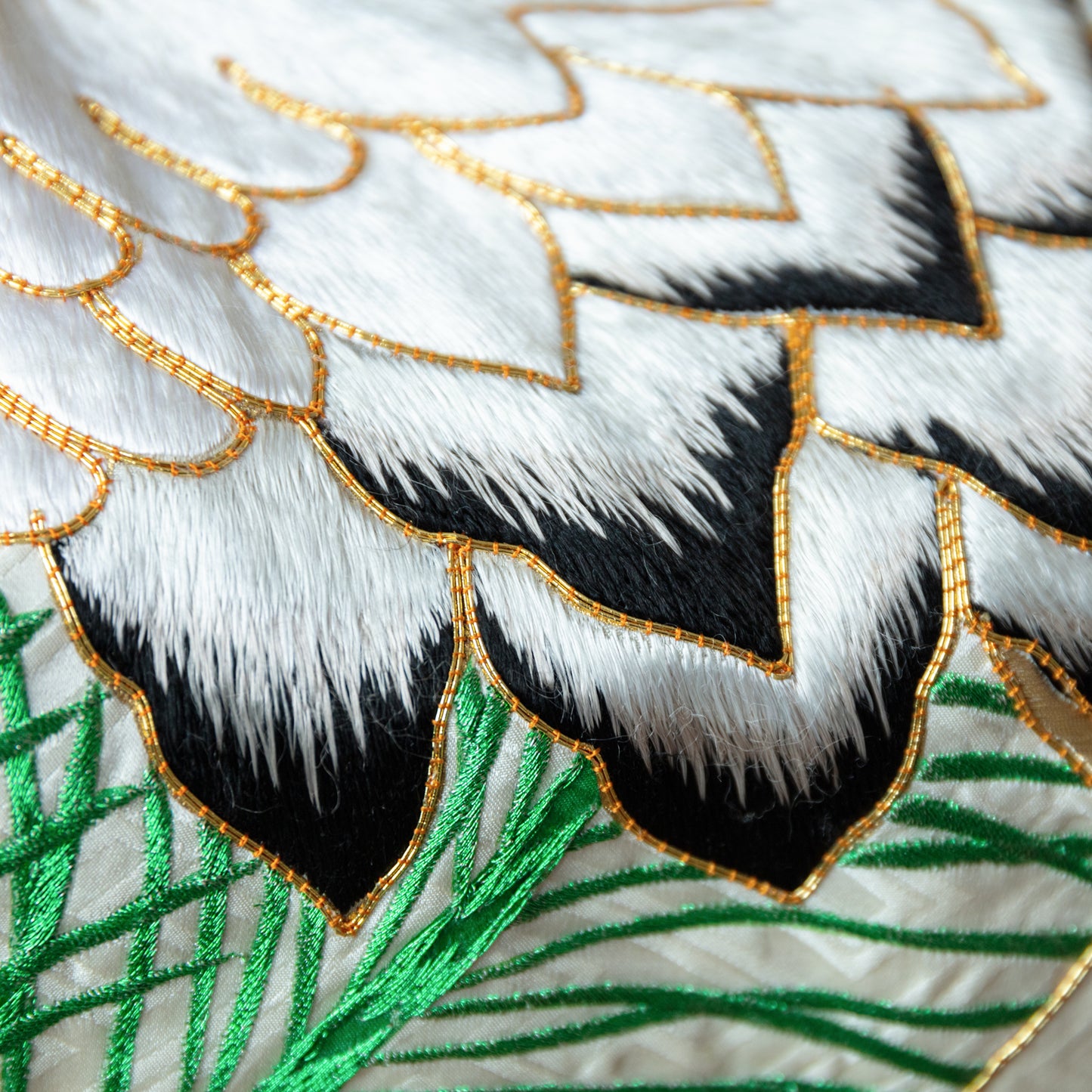 Raised couchwork embroidery