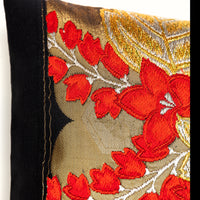 Detail of the kiri obi pillow, fine gold lines and floral embroidery