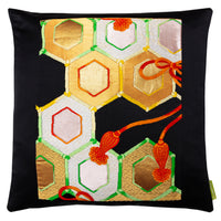 Gold and black geometric hexagon pattern pillow made from vintage obi silk by Hunted and Stuffed, London.