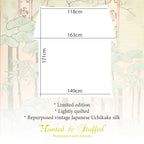 Close-up of the intricate silk embroidery along the kimono edge, highlighting delicate stitching and subtle color variations.