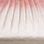 Close-up of the pink silk fabric’s ombre gradient and subtle textural sheen on the vintage Japanese clutch, showcasing