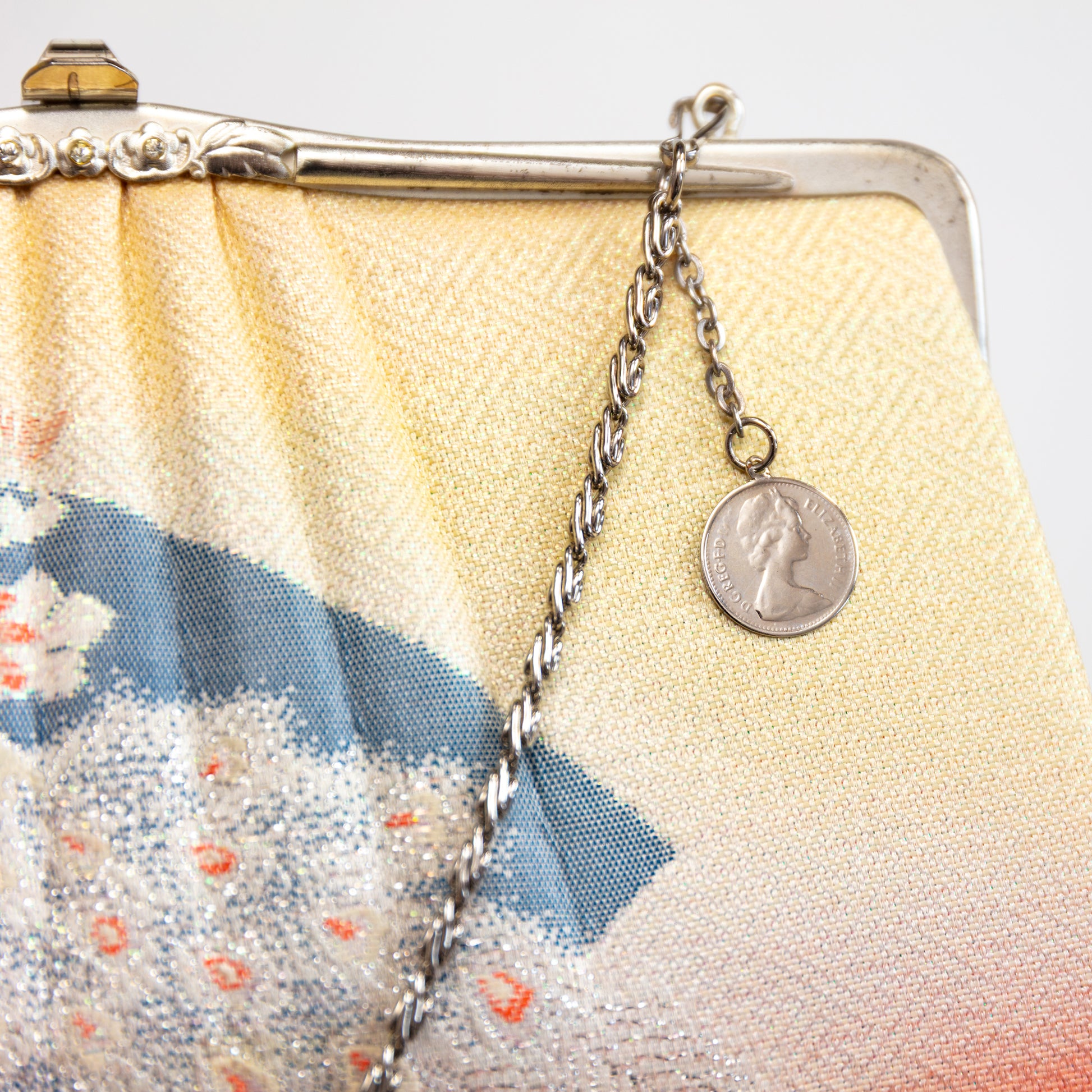 Vintage 1950s Japanese kimono silk  handbag with floral design and chain strap featuring a coin charm.