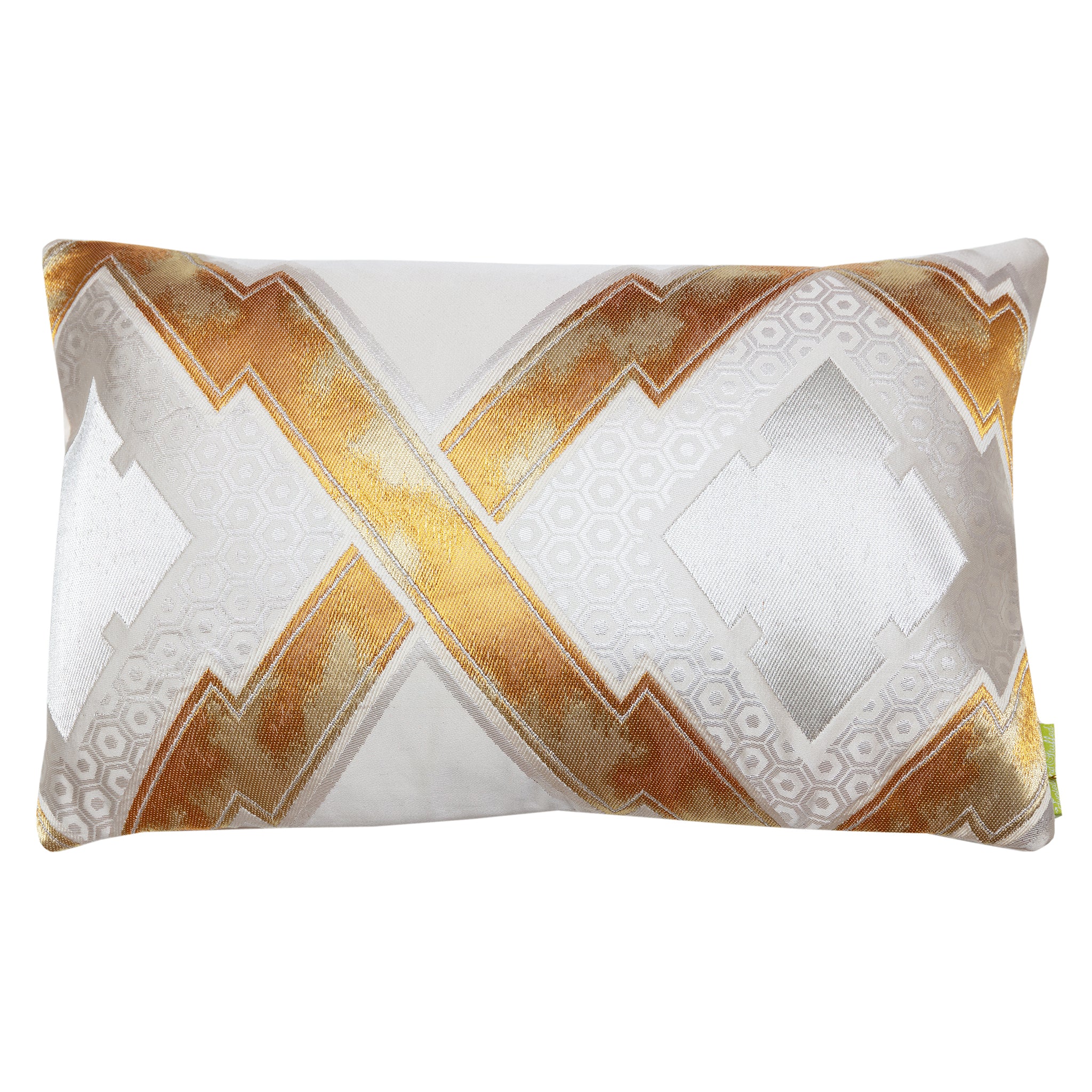 Close-up of gold embroidery and metallic geometric pattern on the textured silk surface of the Obi cushion, highlighting
