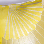 Close-up of the golden fan embroidery detail on the silk bolster pillow’s Chartreuse satin backing from a top-down angle.