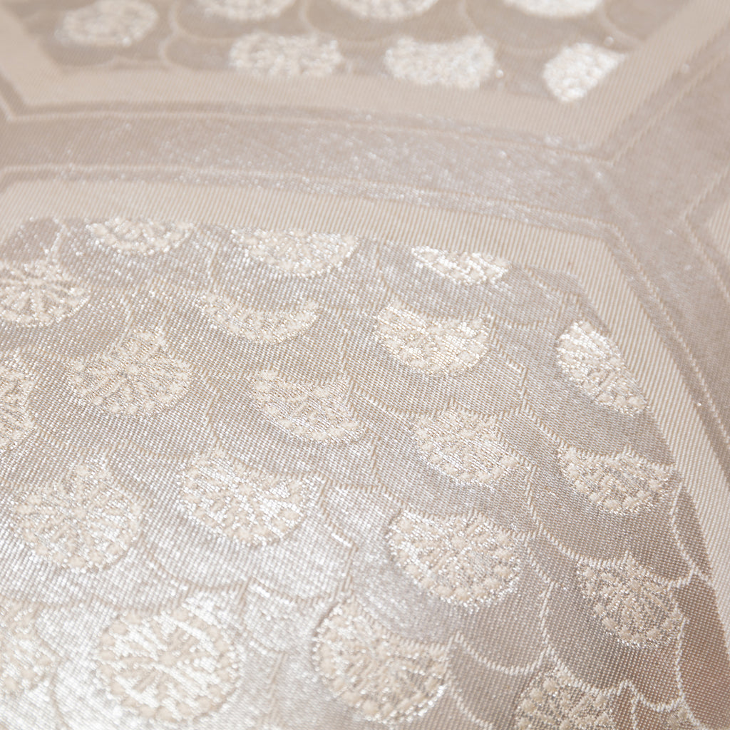 Close-up of textured oyster velvet back and subtle stitching details on the metallic silver long bolster cushion.