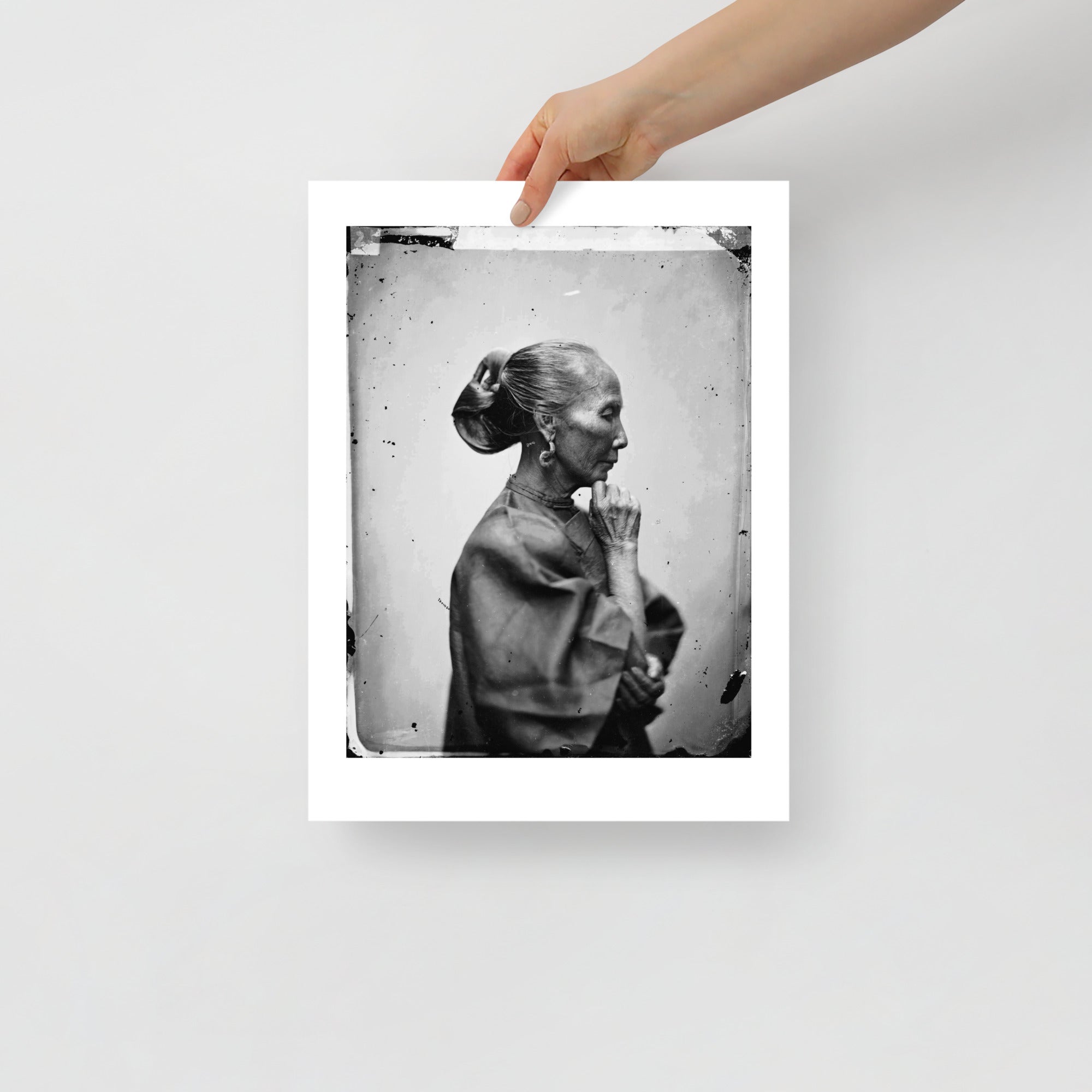 Black and white portrait detail emphasizing textured fabric collar and intricate brushwork around woman's neck area