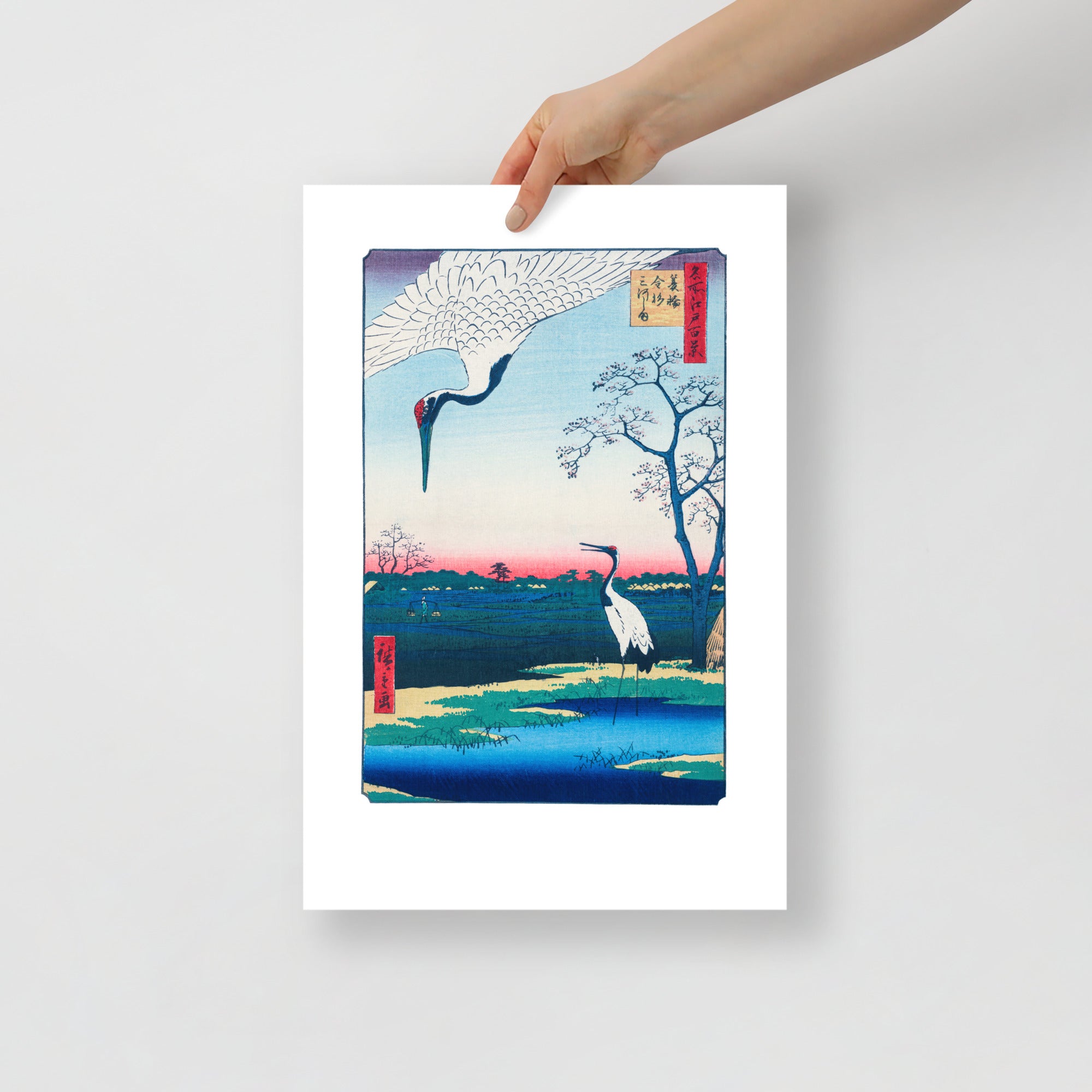 Close-up of the intricate woodgrain texture highlighting the delicate brushwork in the cranes' plumage and background