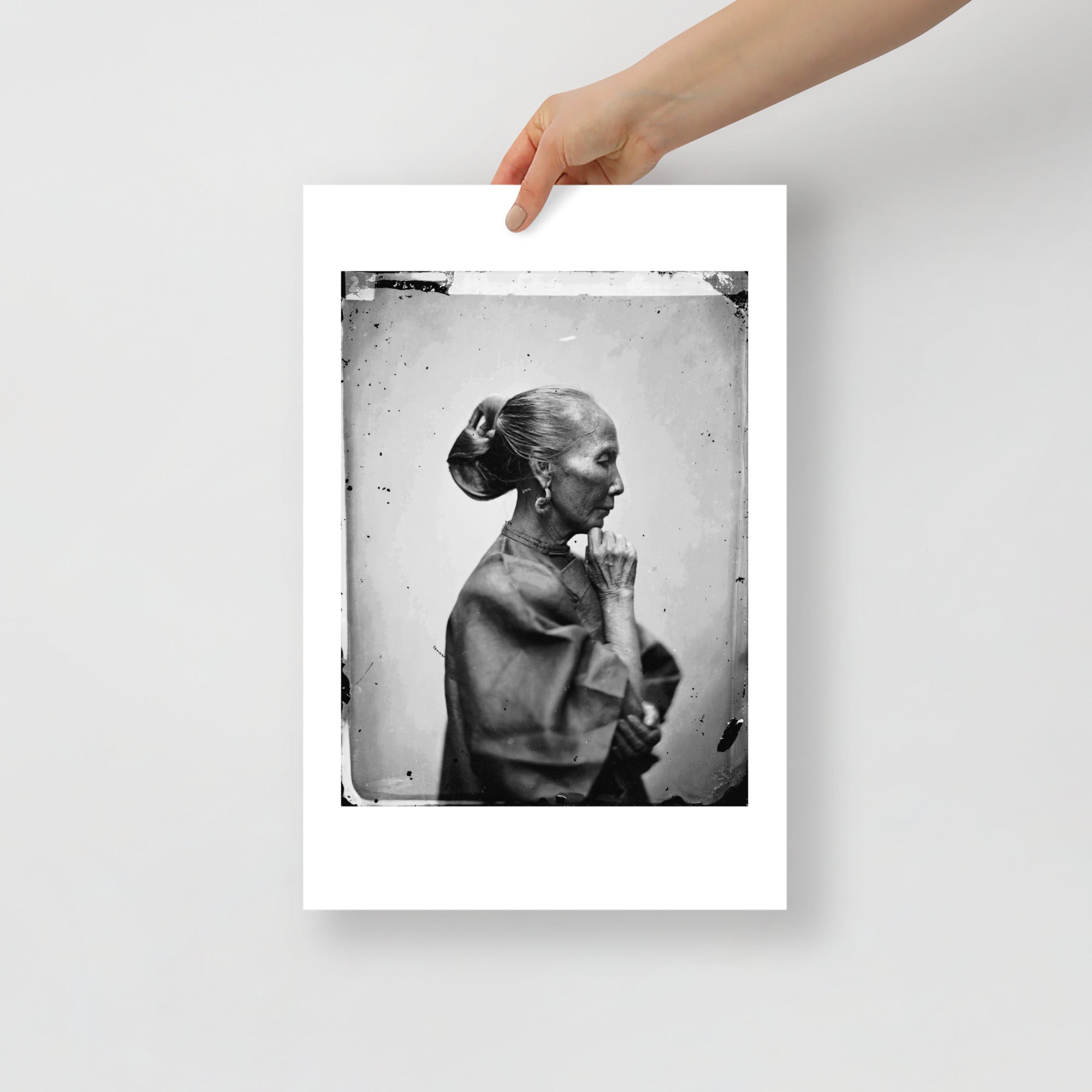 Close-up of fine brushstrokes highlighting intricate facial details and subtle shading in the black and white portrait print.