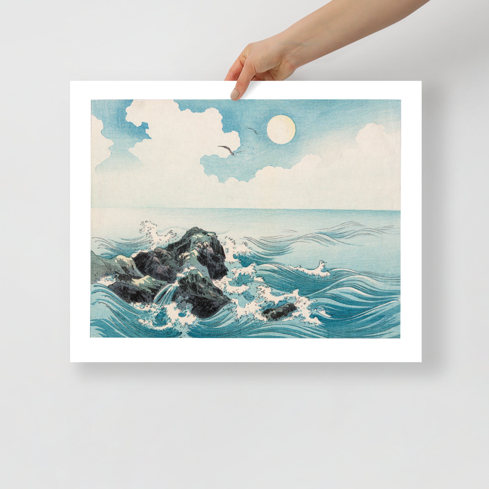 Detail of crashing wave foam and textured woodgrain in the Japanese woodcut print’s dynamic shoreline scene from a diagonal