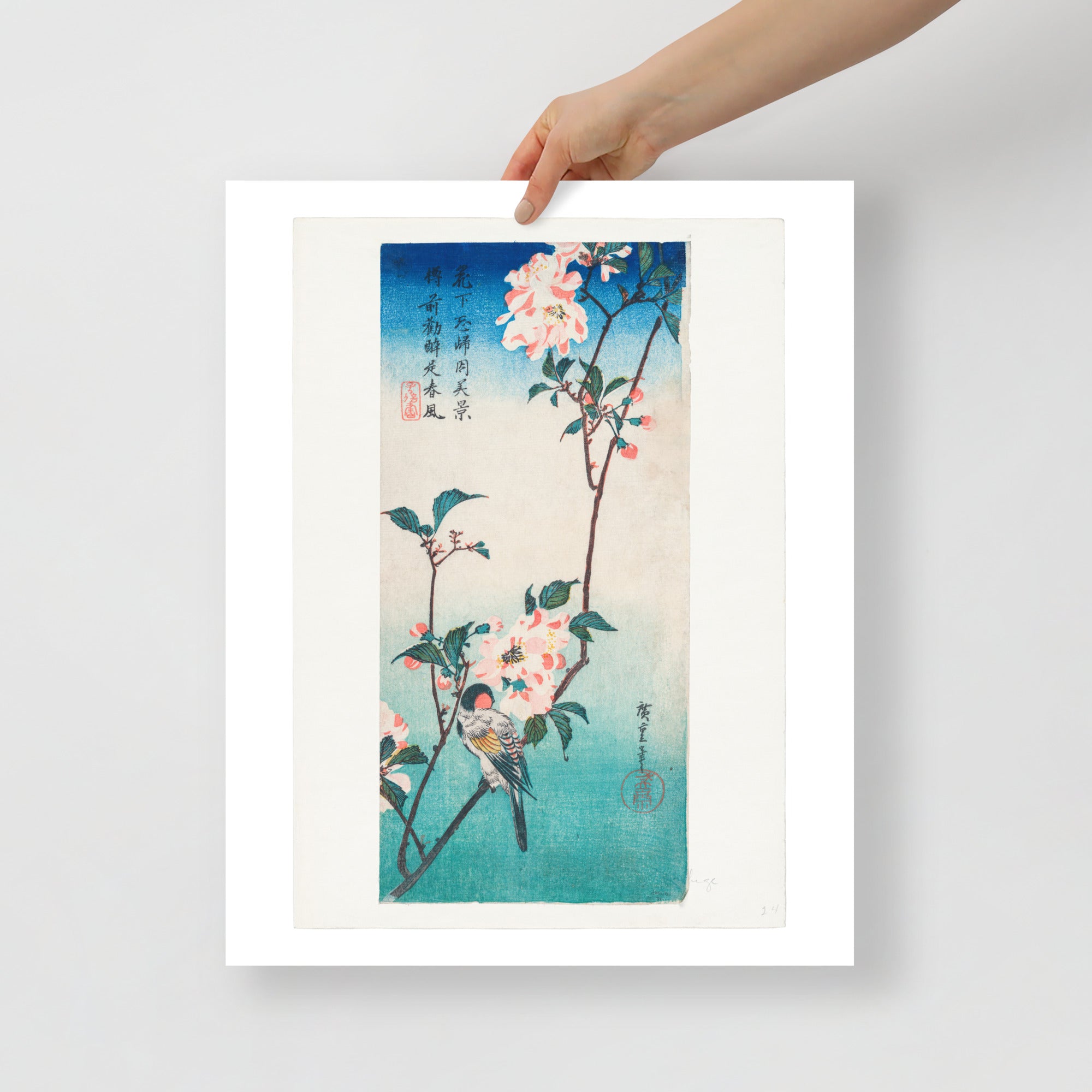 Close-up of delicate cherry blossoms and tiny birds amid detailed floral patterns on the print's lower corner.