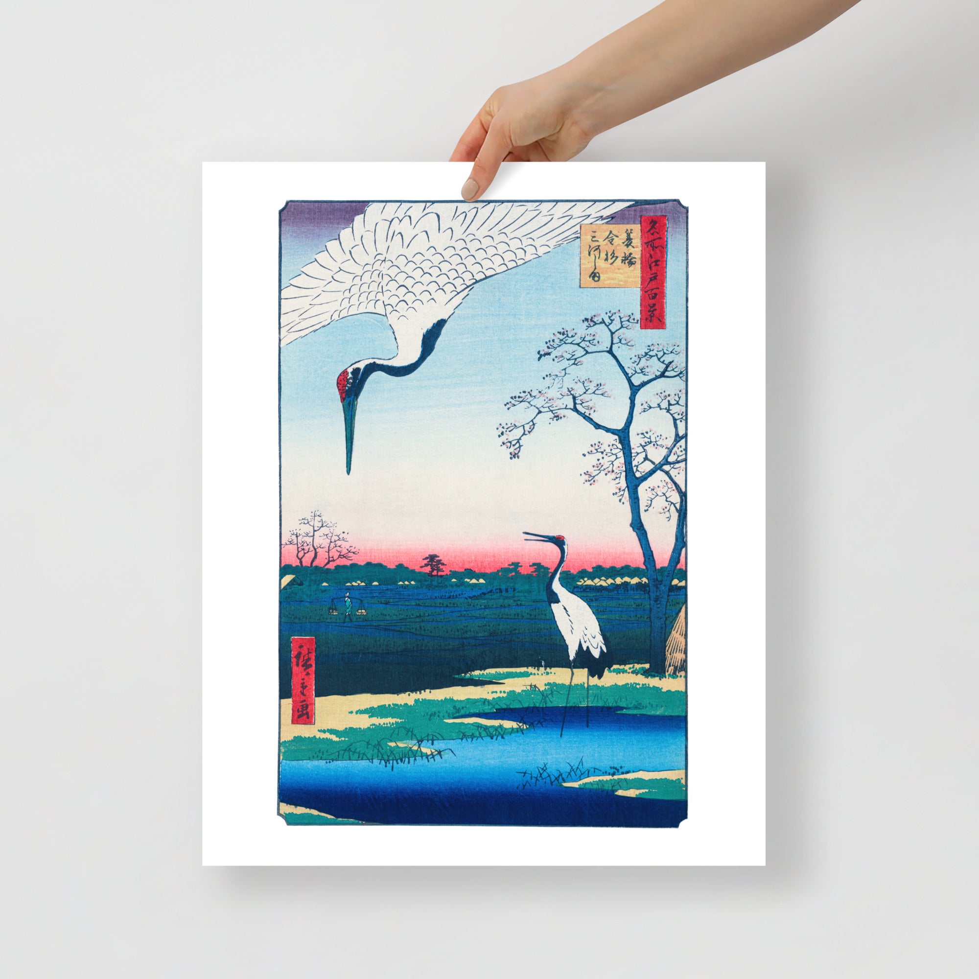 Close-up of the detailed woodgrain texture and vibrant ink lines highlighting cranes' plumage on the Hiroshige Japanese