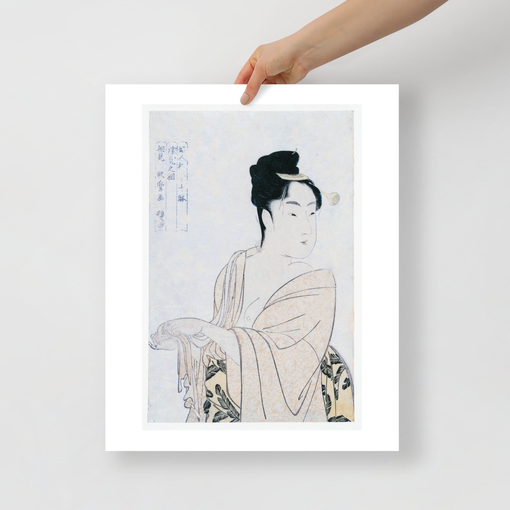 Close-up of Utamaro's delicate ink lines and textured paper surface highlighting intricate facial details and subtle shading.