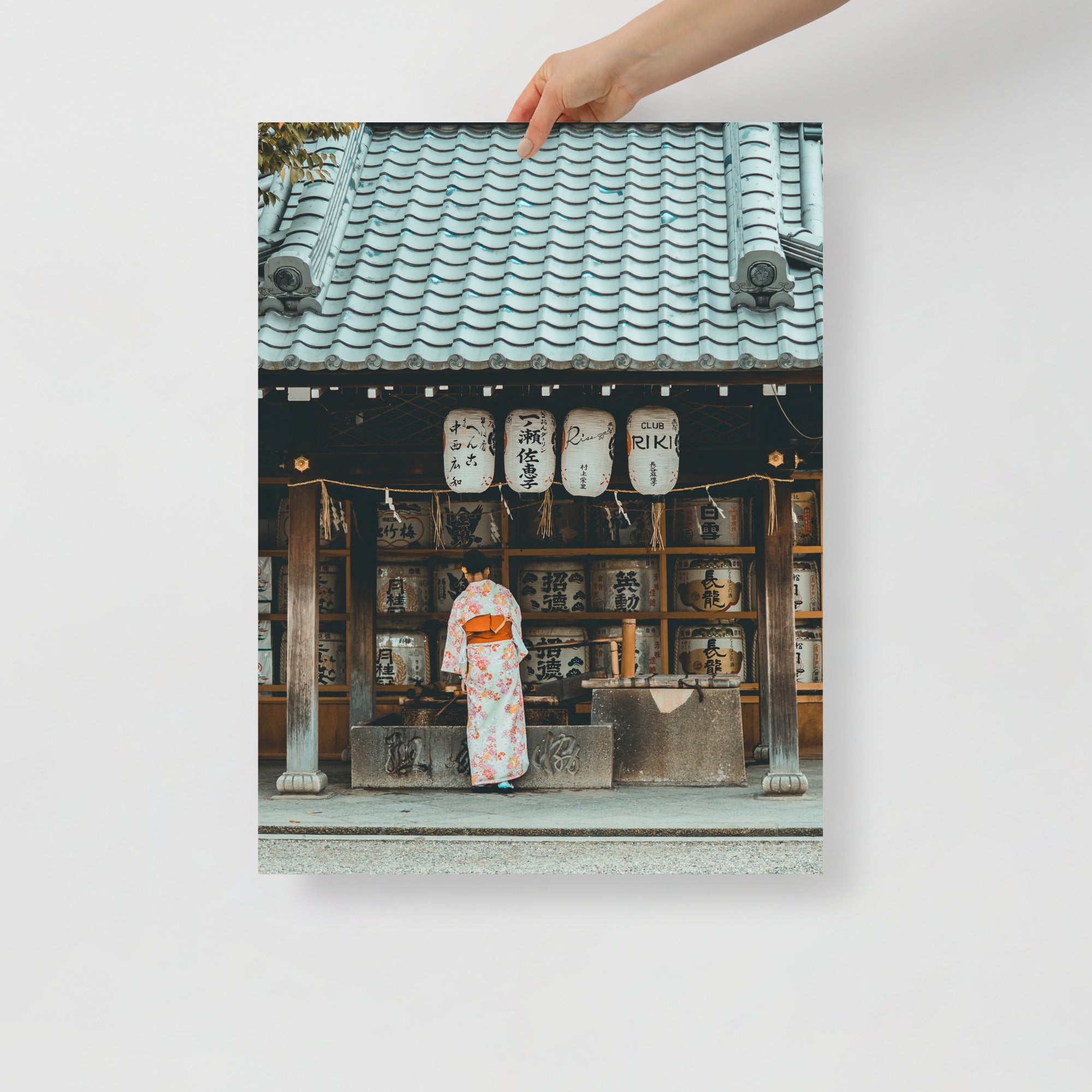 Close-up of detailed kimono fabric featuring intricate lady print with vibrant colors and delicate brushstroke textures.