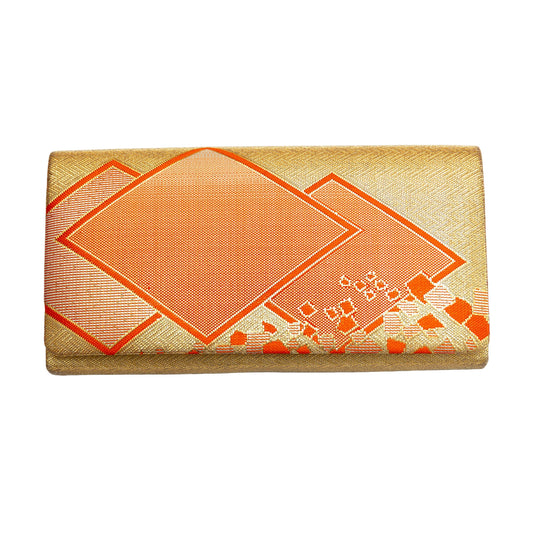 Gold clutch with orange geometric pattern on a white background