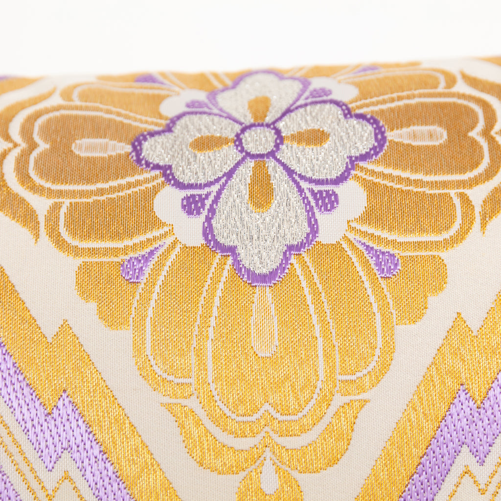 Close-up of purple accent fabric and intricate gold diamond embroidery detail on the vintage Pine Bark Hanabishi Obi Cushion