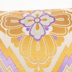 Close-up of purple accent fabric and intricate gold diamond embroidery detail on the vintage Pine Bark Hanabishi Obi Cushion