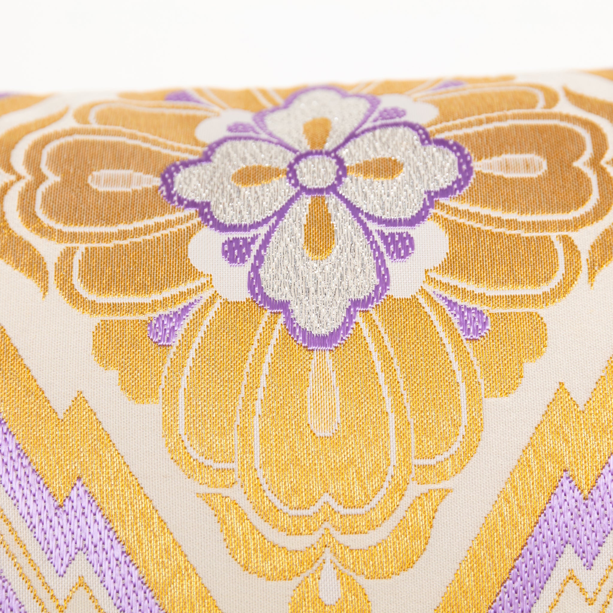 Close-up of purple accent fabric and intricate gold diamond embroidery detail on the vintage Pine Bark Hanabishi Obi Cushion