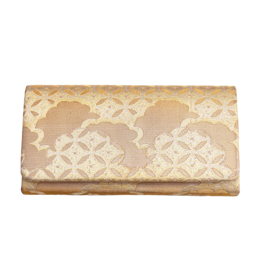 Decorative gold silk clutch bag with shippo and cloud patterns on a white background