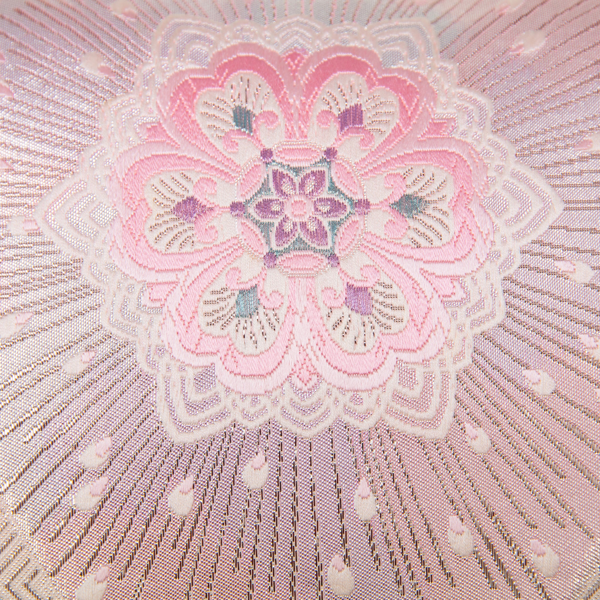 Close-up of the pink ombre silk texture highlighting silver hanabishi floral hexagon embroidery detail from a top-down