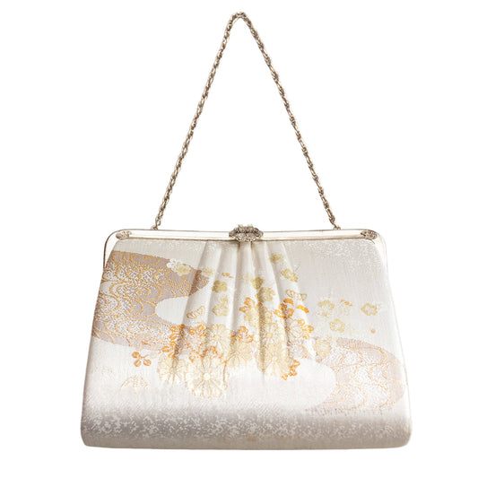 Elegant vintage ivory Japanese silk clutch bag with floral design and chain strap on a white background
