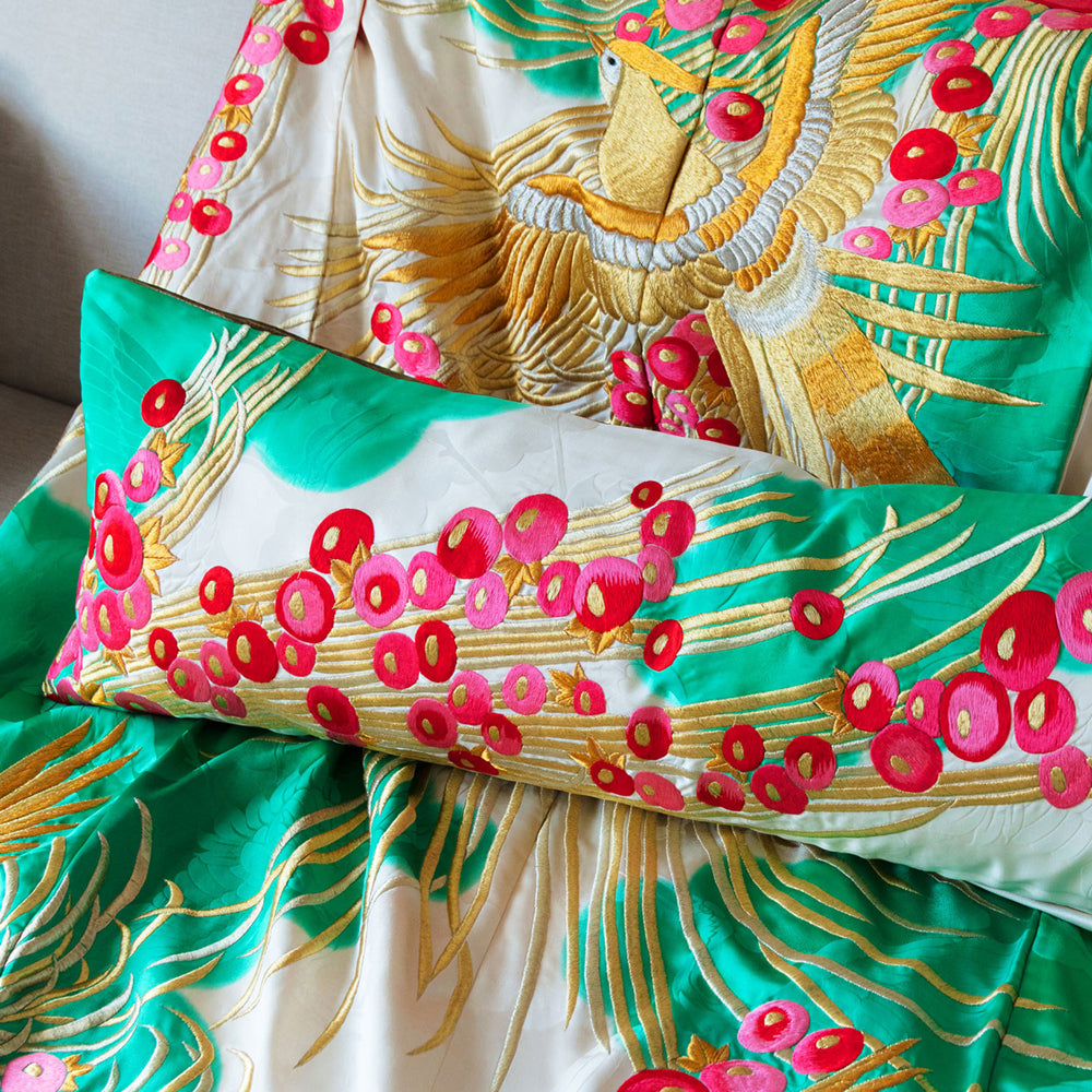 Decorative pillow with floral pattern on a matching silk quilt background. Made from recycled Japanese kimono silk by Hunted and Stuffed, London.