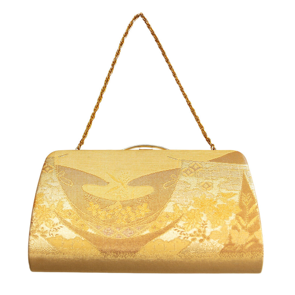 Close-up of intricate gold embroidery and floral motifs on the vintage Japanese silk clutch’s front panel, highlighting