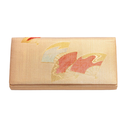 Vintage metallic gold clutch bag with Japanese fans design on a white background