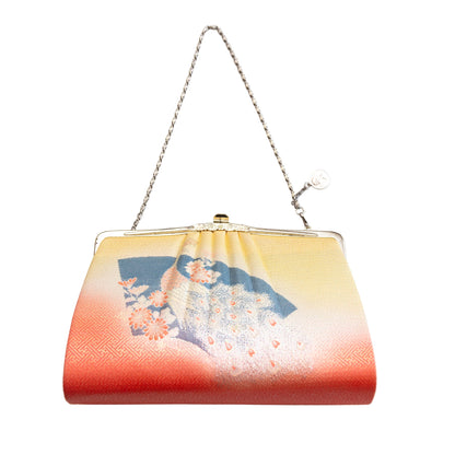 Peacock, fan and floral patterned vintage Japanese silk handbag with a chain strap on a white background
