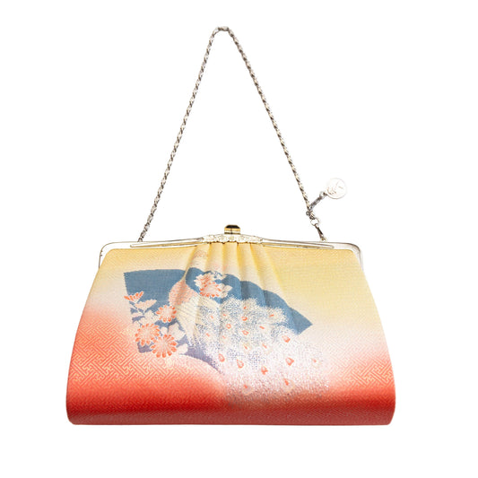 Peacock, fan and floral patterned vintage Japanese silk handbag with a chain strap on a white background