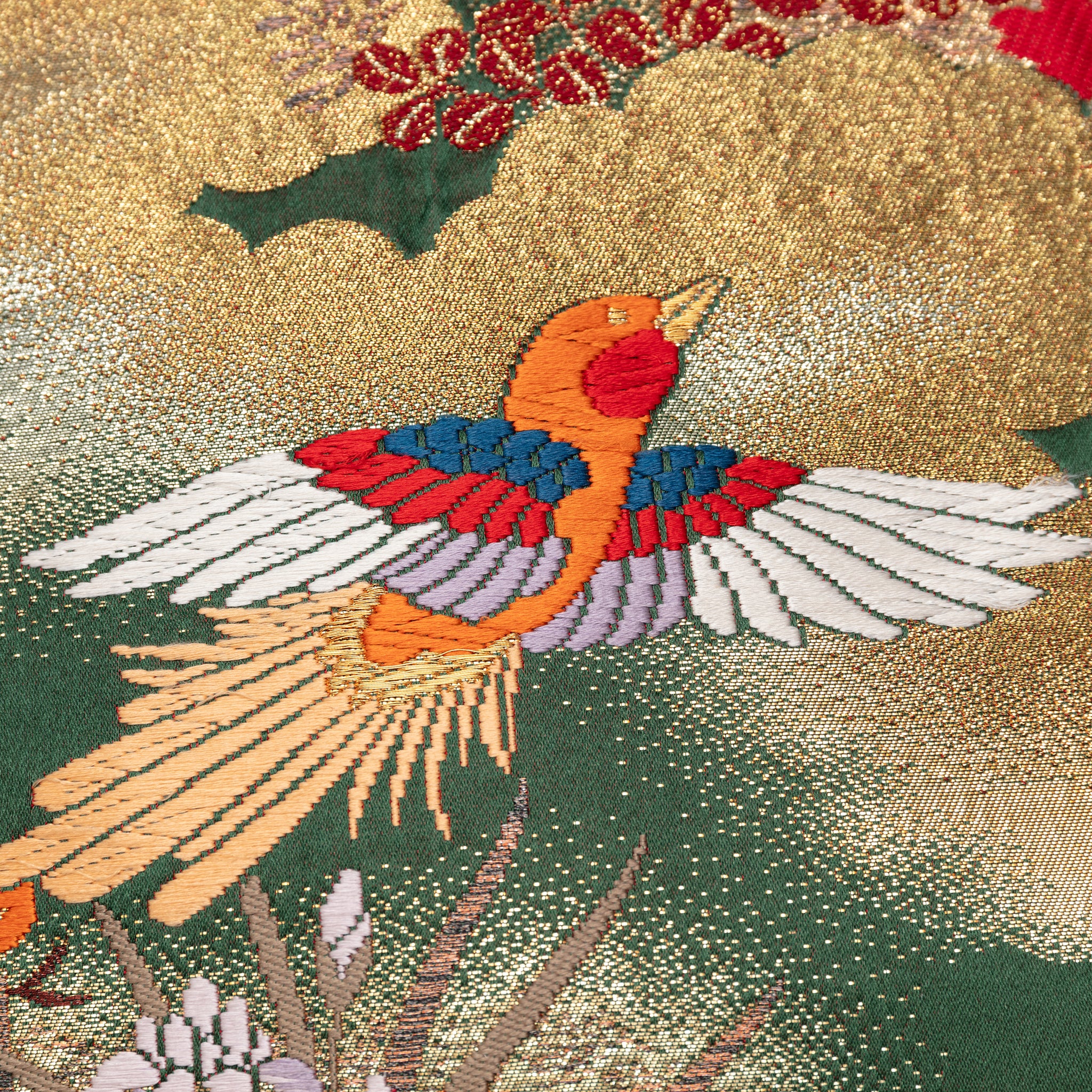 Close-up of green silk fabric detail showing intricate gold velvet embroidery on the 16-inch Oriental Cushion pair