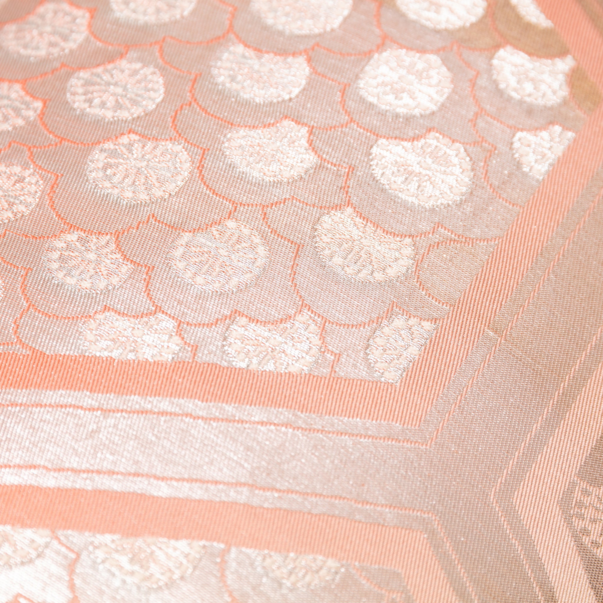 Close-up of the Peach Cream Kimono Bolster Pillow’s Oyster back, highlighting smooth fabric texture and subtle sheen detail.