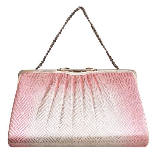 Pink and silver handbag with a chain strap on a white background