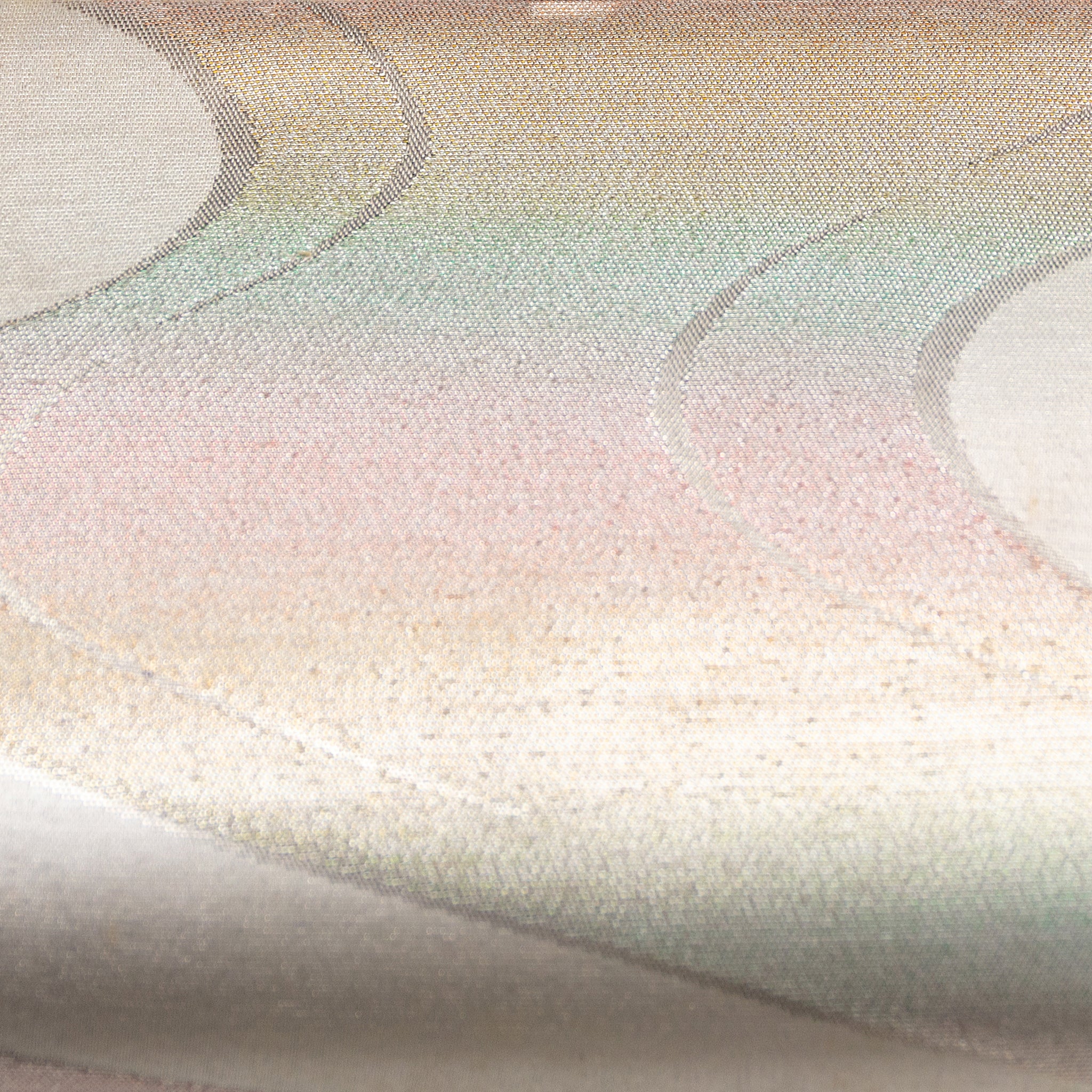 Close-up of iridescent river surface pattern on the silver chain clutch’s textured fabric, highlighting subtle shimmer