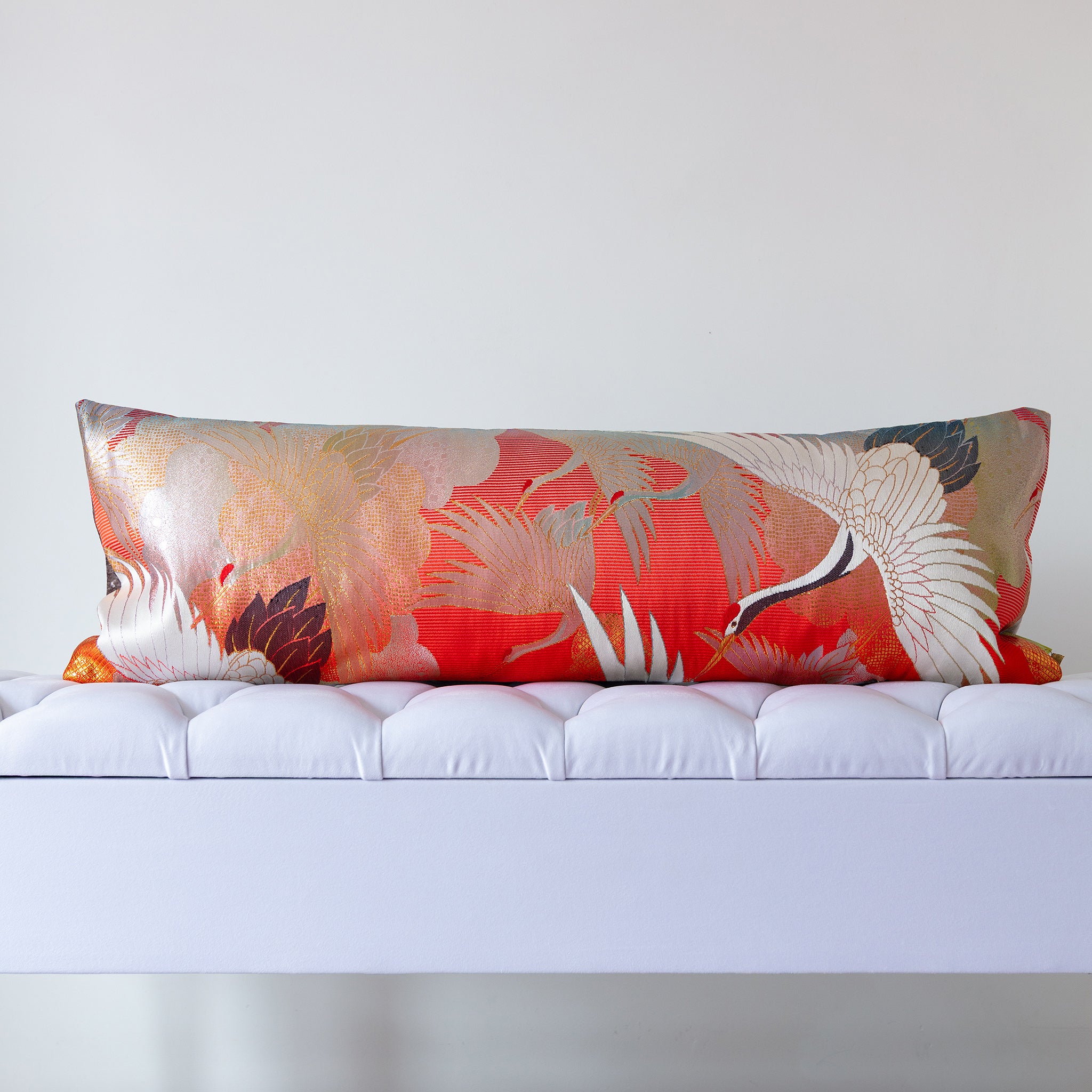 Red silk kimono bolster cushion with gold and white cranes flying left, crafted from vintage Japanese silk