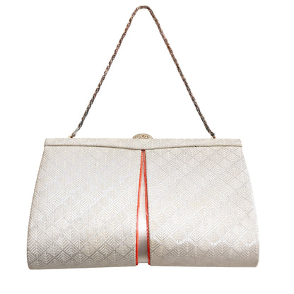 White textured vintage Japanese silk handbag with a silver chain strap and fancy clasp on a white background
