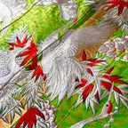 Close-up of the intricate silk embroidery detailing floral motifs along the kimono’s edge, highlighting craftsmanship and