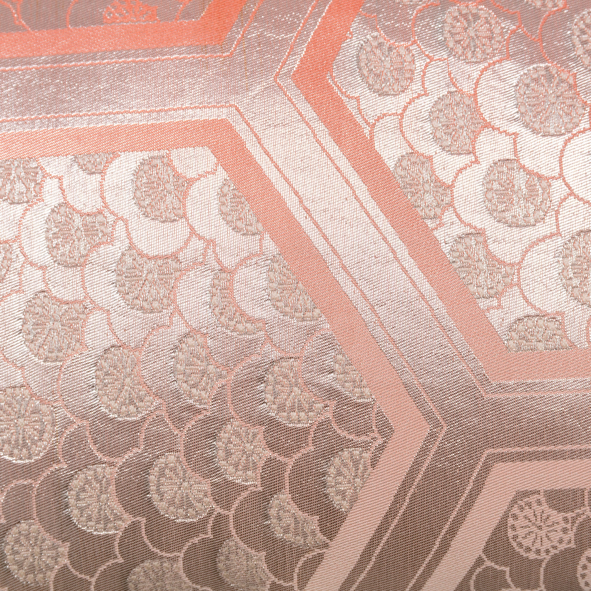 Close-up of the Peach Cream Kimono Bolster Pillow’s oyster-textured back featuring soft, plush fabric and subtle stitching