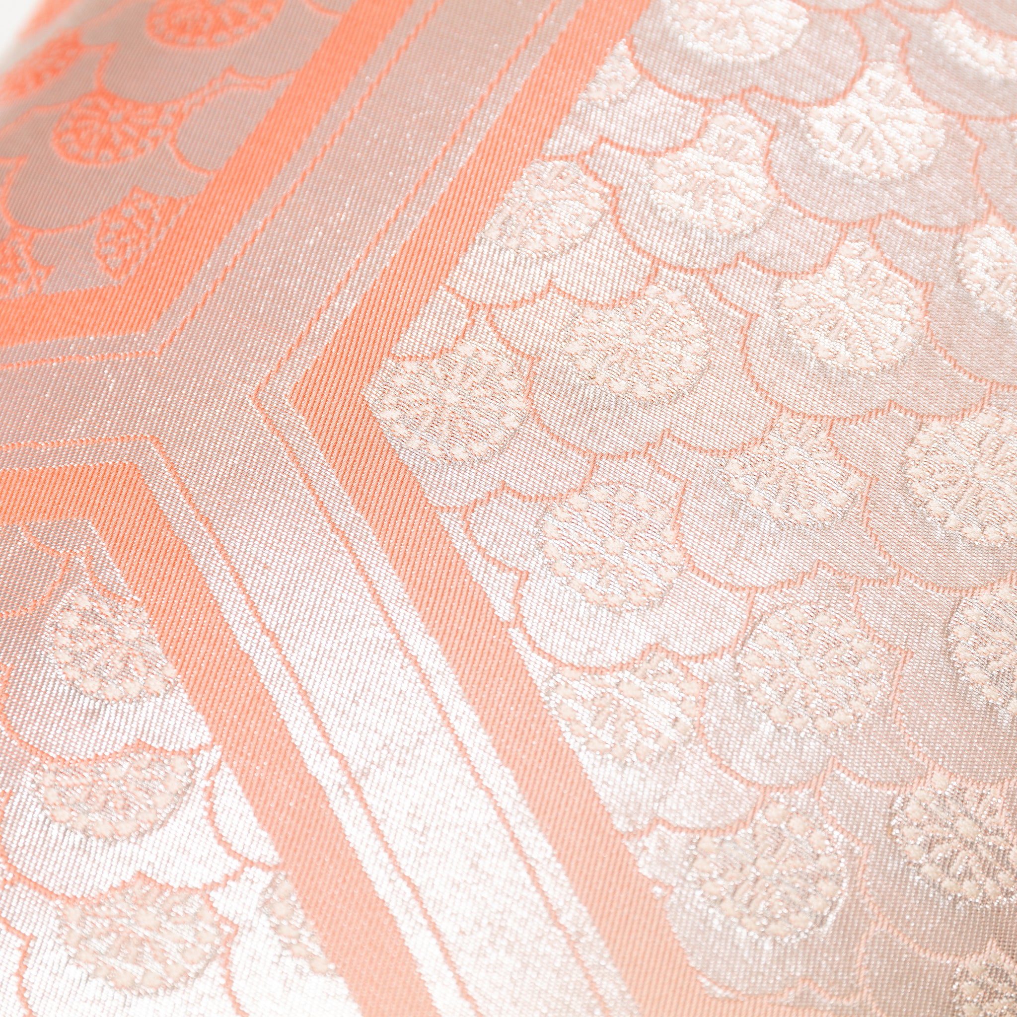 Close-up of the Peach Cream Kimono Bolster Pillow’s oyster back fabric highlighting its smooth texture and subtle sheen