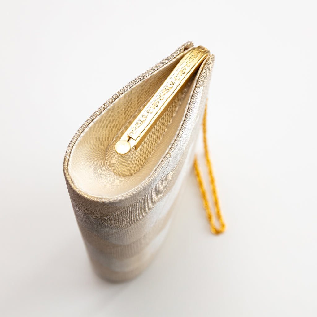 Close-up of gold hexagon silk embroidery highlighting intricate texture and shimmering metallic accents on vintage Japanese