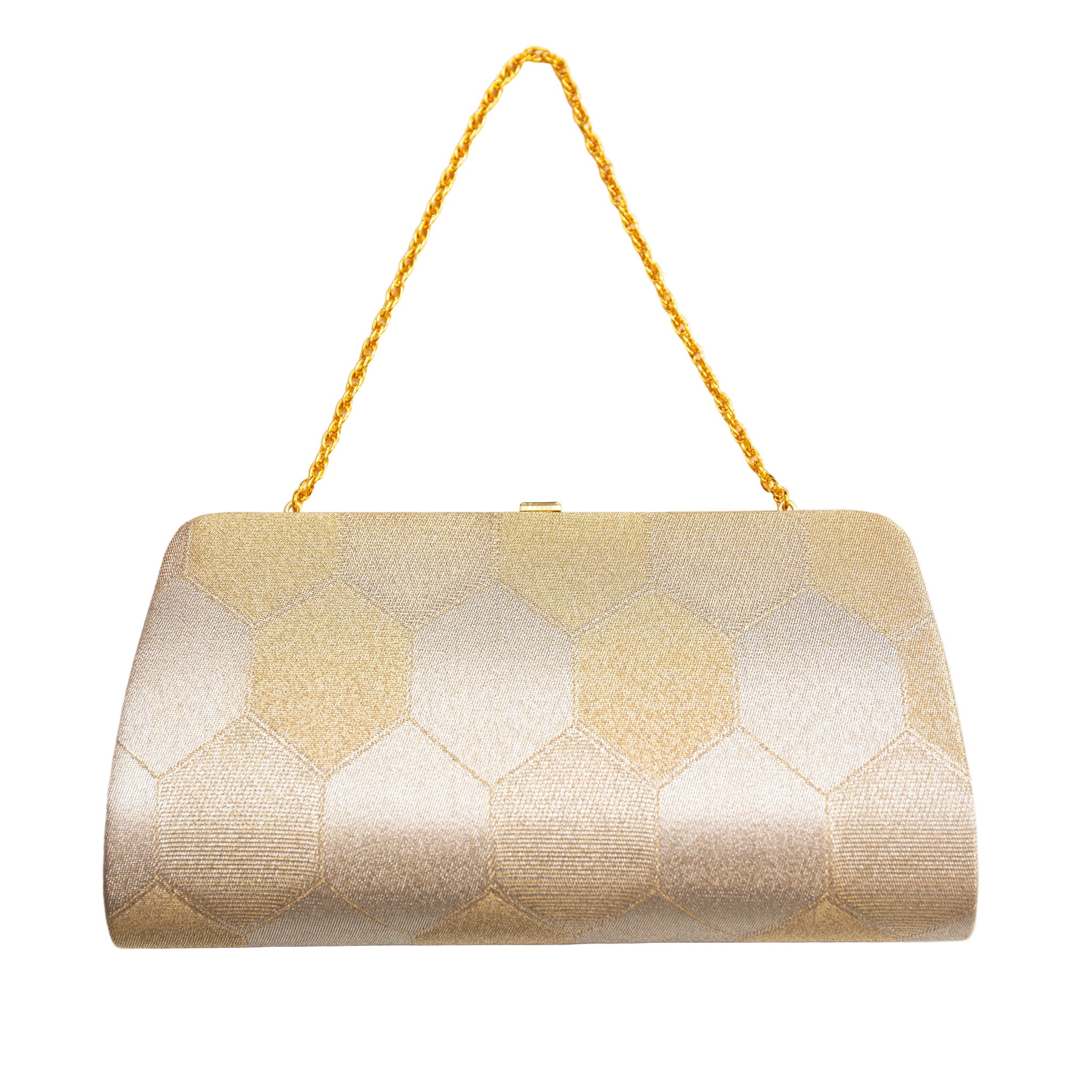 Close-up of the gold clutch’s vintage Japanese silk fabric highlighting intricate hexagon embroidery and subtle metallic