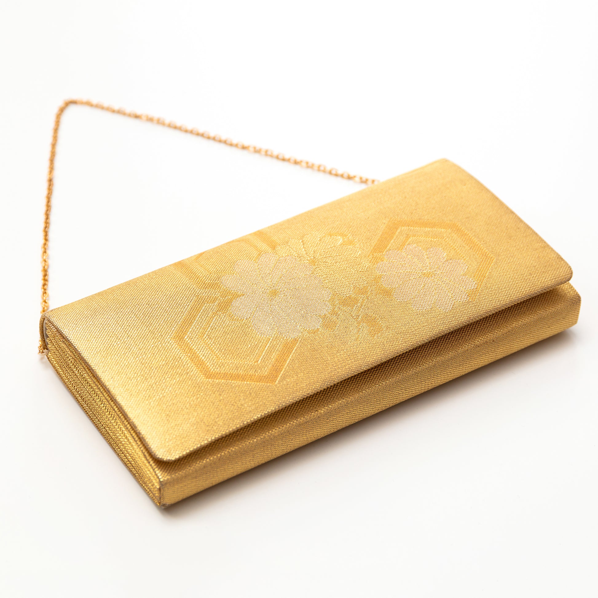 Gold clutch bag with floral embroidery on a white background